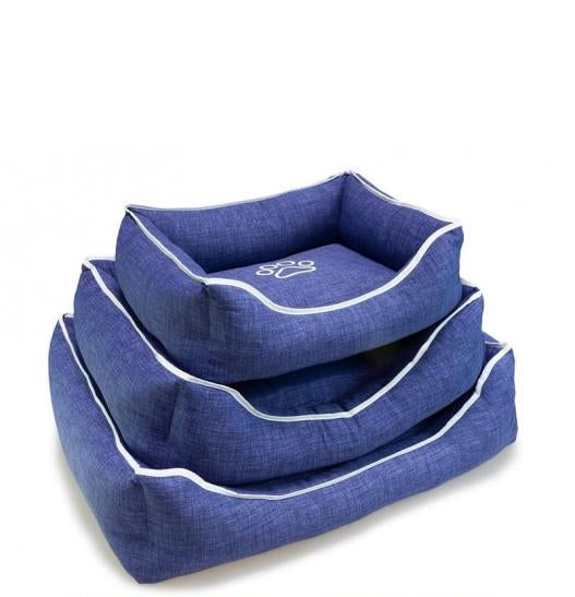 Cama cuadrada azul con huella y ribete 55x46x17 cm.